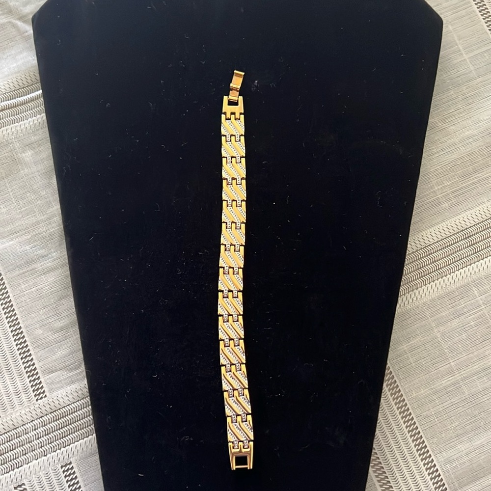 Silver and gold bracelet with excellent clasp. Gently used.